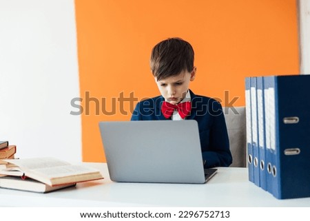a student works in classroom office in an educational institution behind a laptop in the office