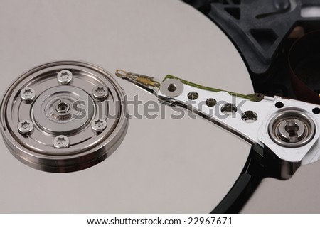 Close-up of a hard drive needle and platter
