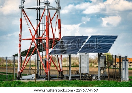 Repeater base station with ecological solar panel. Technology concept Royalty-Free Stock Photo #2296774969