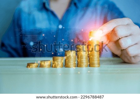 Stock Funding, coins graphed. Business success investment stock wealth concept. Coin graphs show increasing inflation. Coin graphs show increasing inflation. stock market volatility. Royalty-Free Stock Photo #2296788487