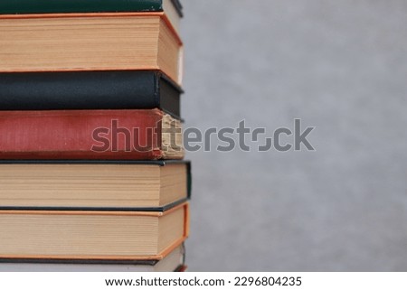 Stack of books on gray