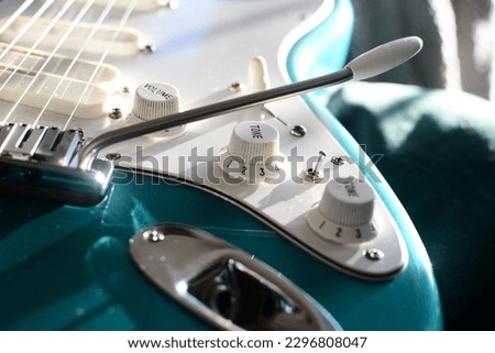 Turquoise electric guitar knobs detail 