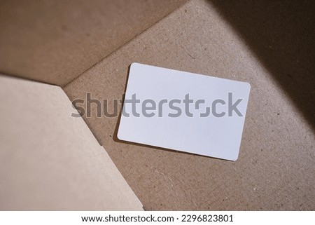 Blank business card, postcard on a colored background. Place for text and information. Mockup