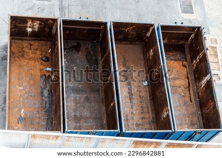 Overview of four old rusty containers as abstract background