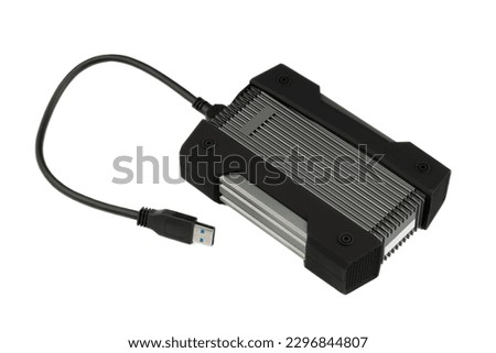 External USB hard drive isolated on white background. Waterproof protected external hard drive. Hard disk for connecting to a laptop, transferring data between a computer and a hard disk. Royalty-Free Stock Photo #2296844807
