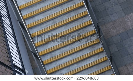 This is the randon picture of people walking up and down a stair.