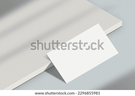 Realistic business card mockup. Simple blank business card on an elegant light background. Business card mock up with shadow overlay effect