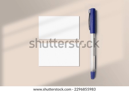 Realistic business card mockup flatlay with a pen. Simple two blank business cards on an elegant light background top view. Two sides of the business card mock up flat lay with shadow overlay effect