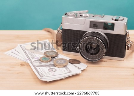 vintage camera with fake money for sell photograph or stock image photographer business career concept