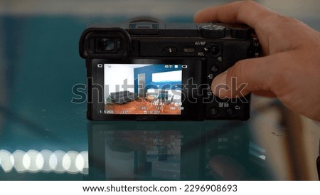 Milan Man  professional Photographer real estate taking  videos and photos of interior of houses for sale - home staging in the kitchen blue wall living room -  photographic  shooting  indoor at home 