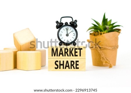 Market share symbol. Concept words Market share on beautiful wooden block. Beautiful white table white background. Black alarm clock. Business and Market share concept. Copy space.