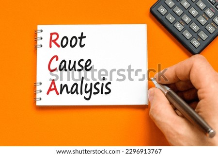 RCA root cause analysis symbol. Concept words RCA root cause analysis on white note. Businessman hand. Beautiful orange table orange background. Business RCA root cause analysis concept. Copy space. Royalty-Free Stock Photo #2296913767
