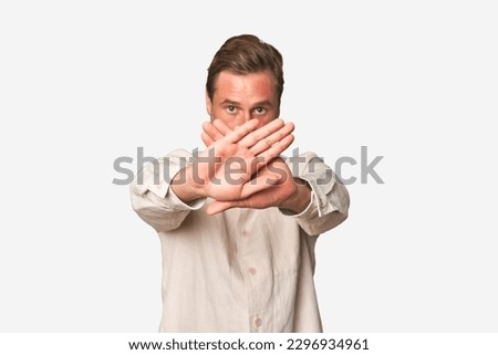 A middle-aged man isolated doing a denial gesture