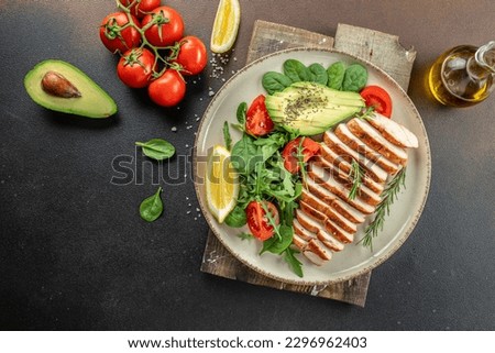 juicy chicken breast grilled with vegetables, Ketogenic diet. Low carb high fat breakfast. Healthy food concept. place for text, top view, Royalty-Free Stock Photo #2296962403