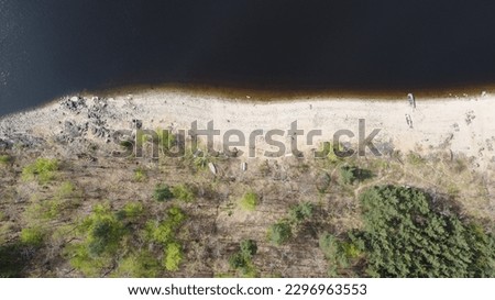 Top view: aerial photo from a flying drone, an amazingly beautiful dark water sea landscape with a copy space for an advertising text message or promotional content. Perfect website background