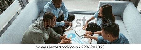 Group of multiethnic business people working together on project while sitting in modern office Royalty-Free Stock Photo #2296981823
