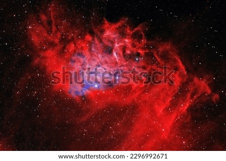 A red galaxy in deep space. Elements of this image furnished NASA. High quality photo