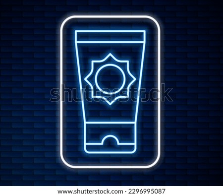 Glowing neon line Sunscreen cream in tube icon isolated on brick wall background. Protection for the skin from solar ultraviolet light.  Vector