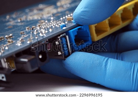 Computer network concept background. Local Area Netwok and high speed internet adapters.  Royalty-Free Stock Photo #2296996195