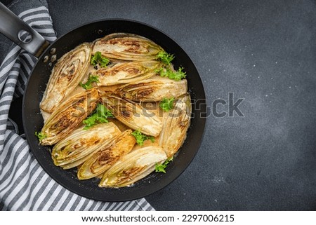 chicory stewed vegetable dish healthy meal food snack on the table copy space food background rustic top view keto or paleo diet veggie vegan or vegetarian food Royalty-Free Stock Photo #2297006215