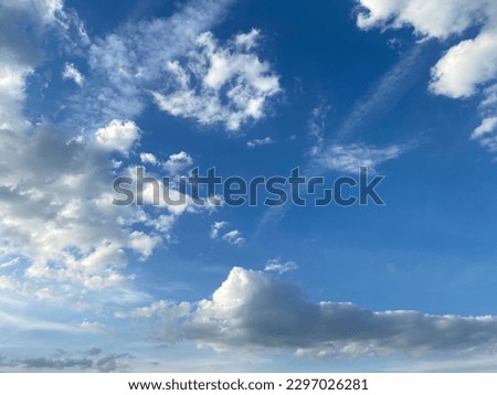 the sky is blue on a cloudy summer day