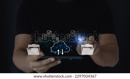 Man hand touch transferring files in virtual screen for Send of document on internet. Data transfer, Transfer file between folder, Backup data, Copy files, data exchange, DMS, Virtual document. Royalty-Free Stock Photo #2297034367