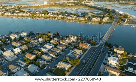 Aerial view of Wrightsville Beach, NC homes during a sunrise. Royalty-Free Stock Photo #2297058943