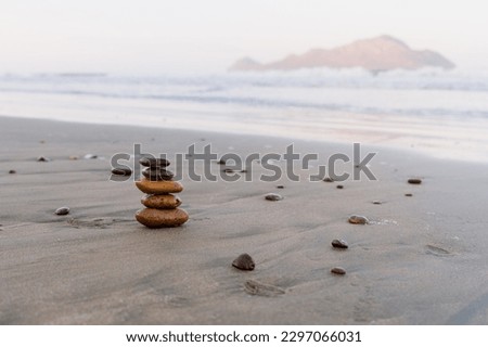 Pile of Rocks at Beach blur background, Rocks on log on beach