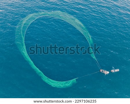 Fishing trawlers are fishing in the sea by huge net in Phu Yen, Vietnam Royalty-Free Stock Photo #2297106235