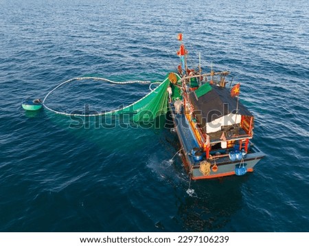 Fishing trawlers are fishing in the sea by huge net in Phu Yen, Vietnam Royalty-Free Stock Photo #2297106239