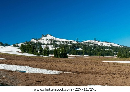 White snow field in Crater Lake National Park, Oregon on a sunny day