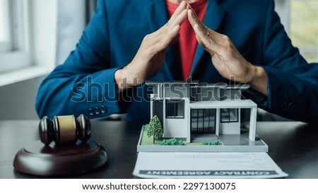 Legal consultant and real estate attorney lawyer read the building lease contract signing agreement for local business. Royalty-Free Stock Photo #2297130075