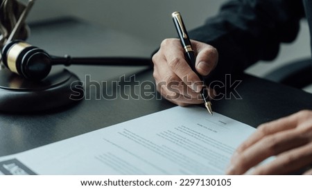 Legal consultant and real estate attorney lawyer read the building lease contract signing agreement for local business. Royalty-Free Stock Photo #2297130105