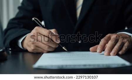 Legal consultant and real estate attorney lawyer read the building lease contract signing agreement for local business. Royalty-Free Stock Photo #2297130107