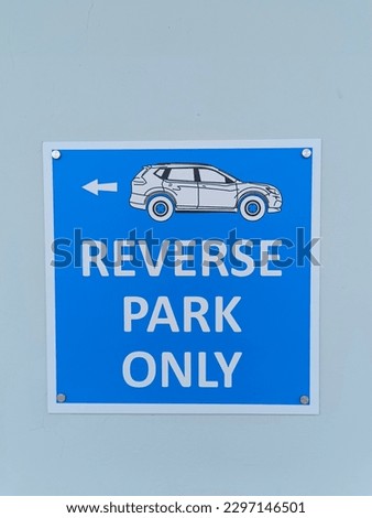great condition parking sign at the office in the middle of summer