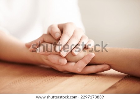 Holding hands, support and people with care for friends, showing empathy and love with kindness. Comfort, hope and a person giving a helping hand for mental health, trust and forgiveness together Royalty-Free Stock Photo #2297173839