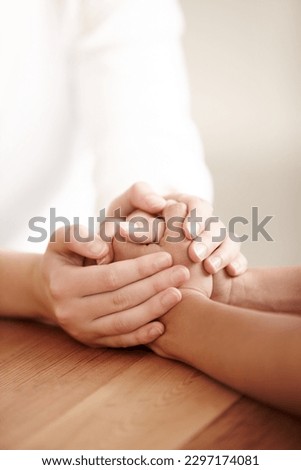 Empathy, love and spiritual with people holding hands in comfort, care or to console each other. Trust, help or support with friends praying together during depression, anxiety or the pain of loss Royalty-Free Stock Photo #2297174081