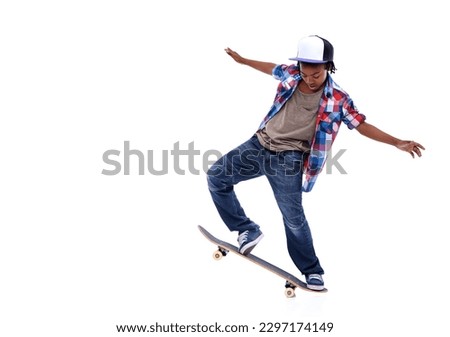 Skateboard, black boy and kid in a studio with mockup and jump trick with young style. Isolated, white background and African male child with a skateboarding and skater with energy and skill Royalty-Free Stock Photo #2297174149