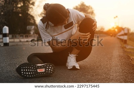 Ankle knee accident in sport exercise running jogging.low key lighting. Royalty-Free Stock Photo #2297175445