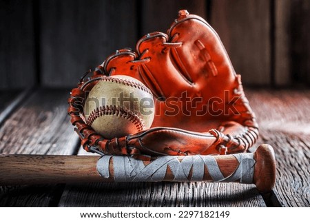 Old baseball ball and stick Royalty-Free Stock Photo #2297182149