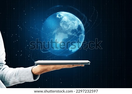 Close up of female hand holding cellphone with glowing blue polygonal globe on blurry background. Global technology and metaverse concept
