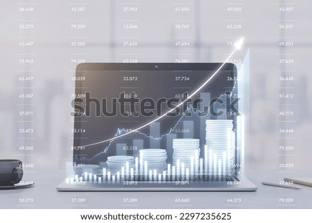 Close up of laptop on desk with coffee cup and growing blue financial coins chart on blurry background. Income growth, invest and market concept. Window with city view background. Double exposure
