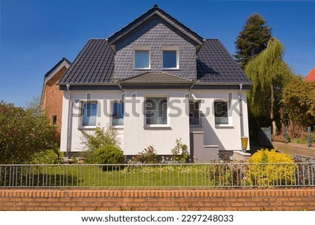 Old single-family house renovated in a modern way Royalty-Free Stock Photo #2297248033