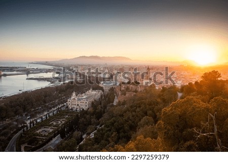 view over Malaga at sunset travel banner