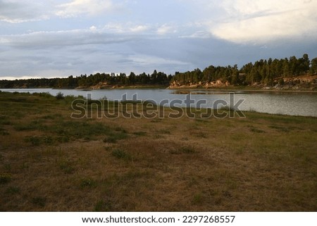 The Keyhole State Park with lake and lush green vegetation under blue cloudy sky Royalty-Free Stock Photo #2297268557