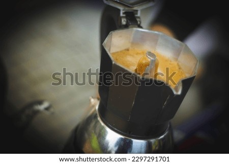 espresso coffee in a stove top moka espresso pot ,moka coffee maker close-up