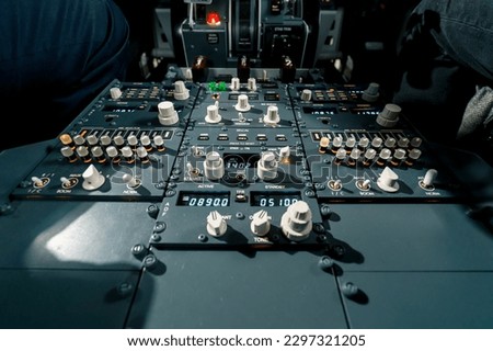 Detailed shot of the cockpit of the passenger plane the control panel of plane flight simulator Royalty-Free Stock Photo #2297321205