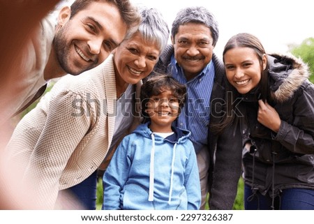 Selfie, love and portrait of a big family on an outdoor adventure, travel or journey together. Happy, smile and boy child taking picture with his grandparents and parents while on holiday or vacation