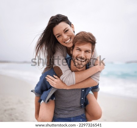 Couple, portrait and piggyback hug at beach for travel, romance and freedom together outdoors. Face, smile and happy woman embracing man on trip, vacation or holiday, bond and having fun in Florida