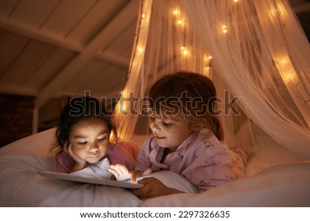 Bed, night and girls with a tablet, movie and playing games with happiness, online reading and relax. Female children, happy kids and young people in a bedroom, evening and technology for fun and app